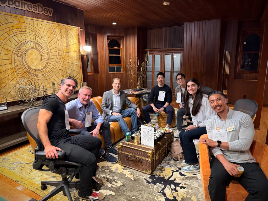 Group portrait of Quantum AI fellows in a wood-panelled lounge